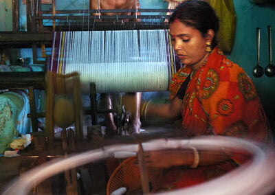 A woman and her husband is weaving at their home © Copyright Apratim Saha. All rights reserved.