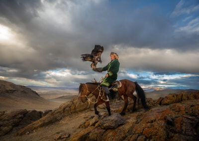 A Kazakh Eagle Hunter with his eagle and horse from Altantsögts district of Bayan-Ölgii Province in western Mongolia.