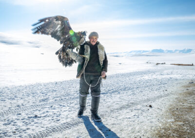 Ermekbay Koshegen, an Eagle Hunter, braves a brutal snowstorm with his eagle Akbalak (Ақбалақ) during the winter migration in the Altai Mountains.