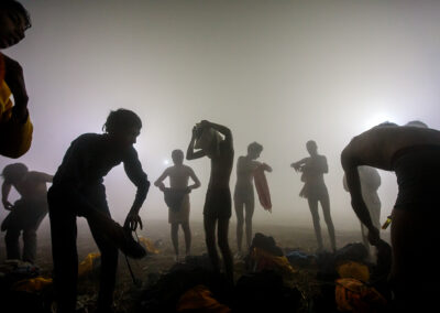 After bathing, a group of young Sadhus gathers early in the morning during the Kumbh Mela in Allahabad, India.