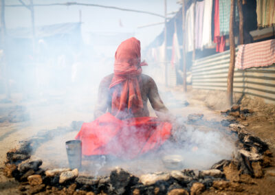 A Vaishnava Sadhu, who is a devotee of Lord Vishnu, is performing Dhuna Tapasya: Panch Agni Tapasya in Allahabad Kumbh Mela in 2019. Sadhus practice a severe austerity called the panch-agni-tapasya, or five-fire practice. During this practice, the sadhu places pieces of burning cow dung around them as they meditate or perform hatha yoga. Over a period of eighteen years, the sadhu gradually increases the number of fires from five at the beginning to a full ring of fire that includes a pot of burning cow dung on the head by the end. This austerity is usually practised during the hottest point of summer, and it severely tests the sadhu's ability to remain focused on their chosen mantra and deity. Sadhus sit in fire for at least five to twelve hours per day in seven stages.