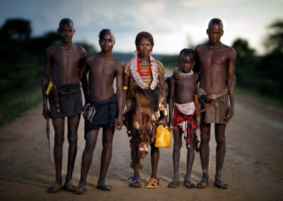 A Hamar tribe family is making their way back to their village after visiting the weekly market.