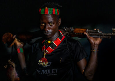 Portrait of a Hamar tribal man of Ethiopia with his firearm.