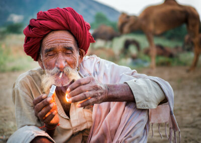 An old camel shepherd with his camel during Pushkar Mela, Rajasthan.